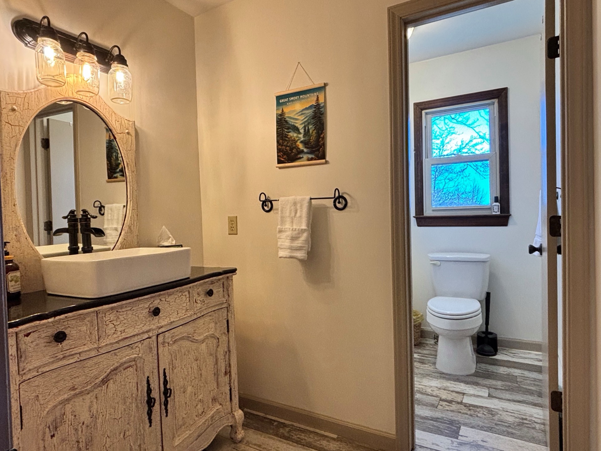 Bathroom with rustic vanity and vessel sink