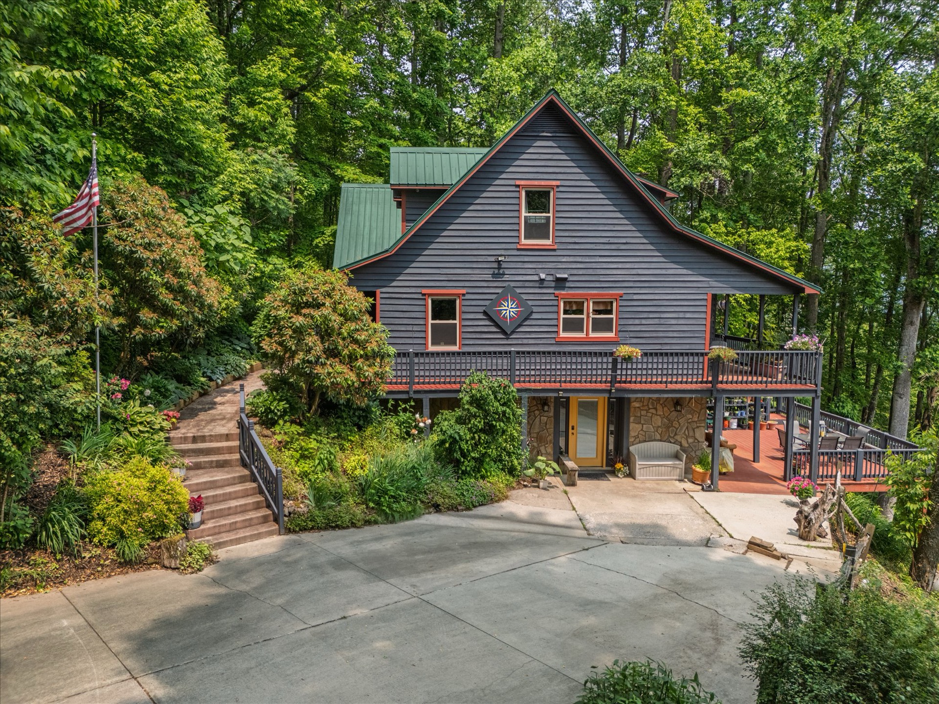 Mountain cabin aerial view with driveway