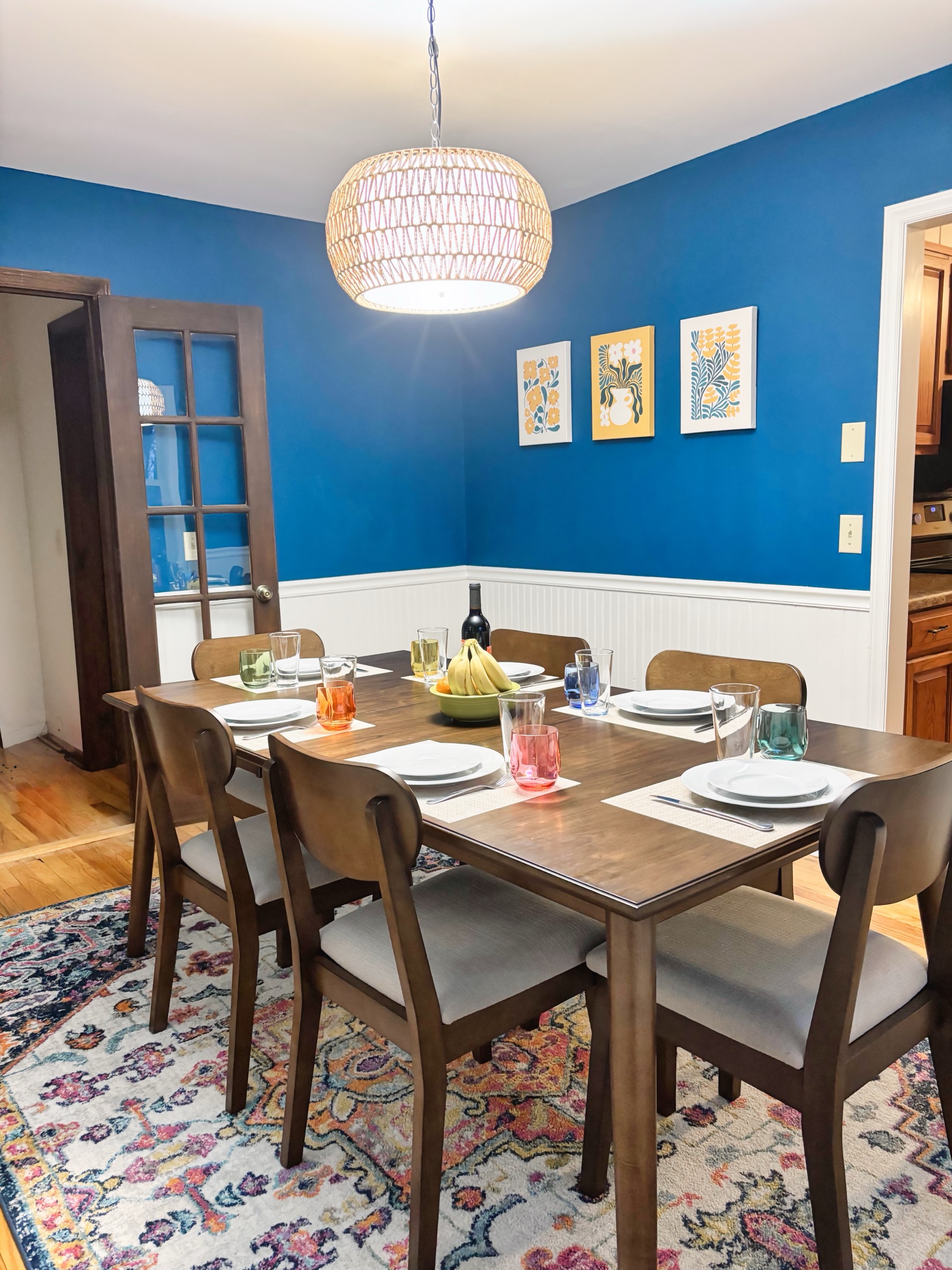 Formal dining room with blue walls set for six