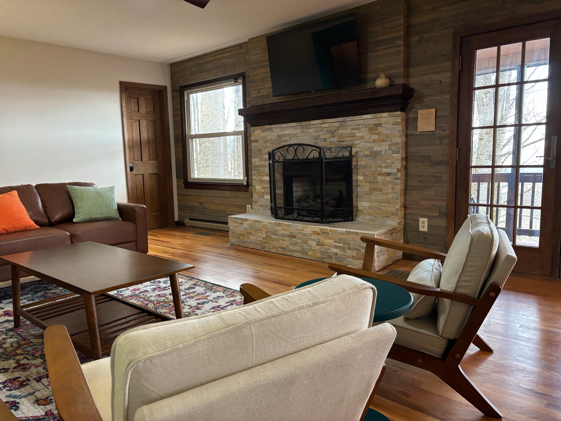 Living room with stone fireplace