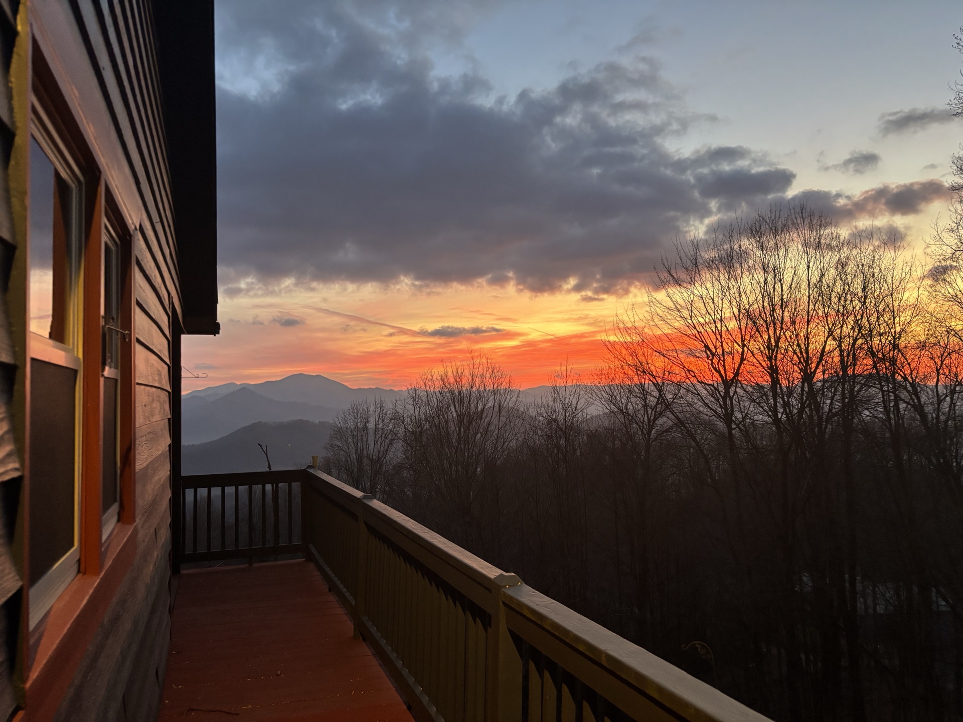 Orange sunset over the mountains from the porch